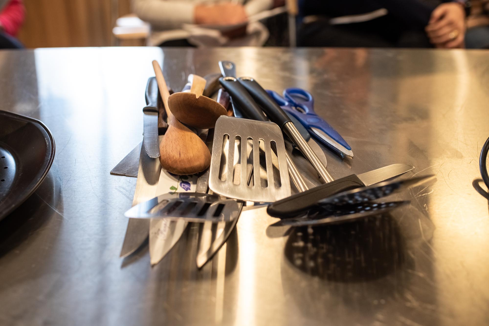 Small workshop kitchen with utensils and fresh ingredients