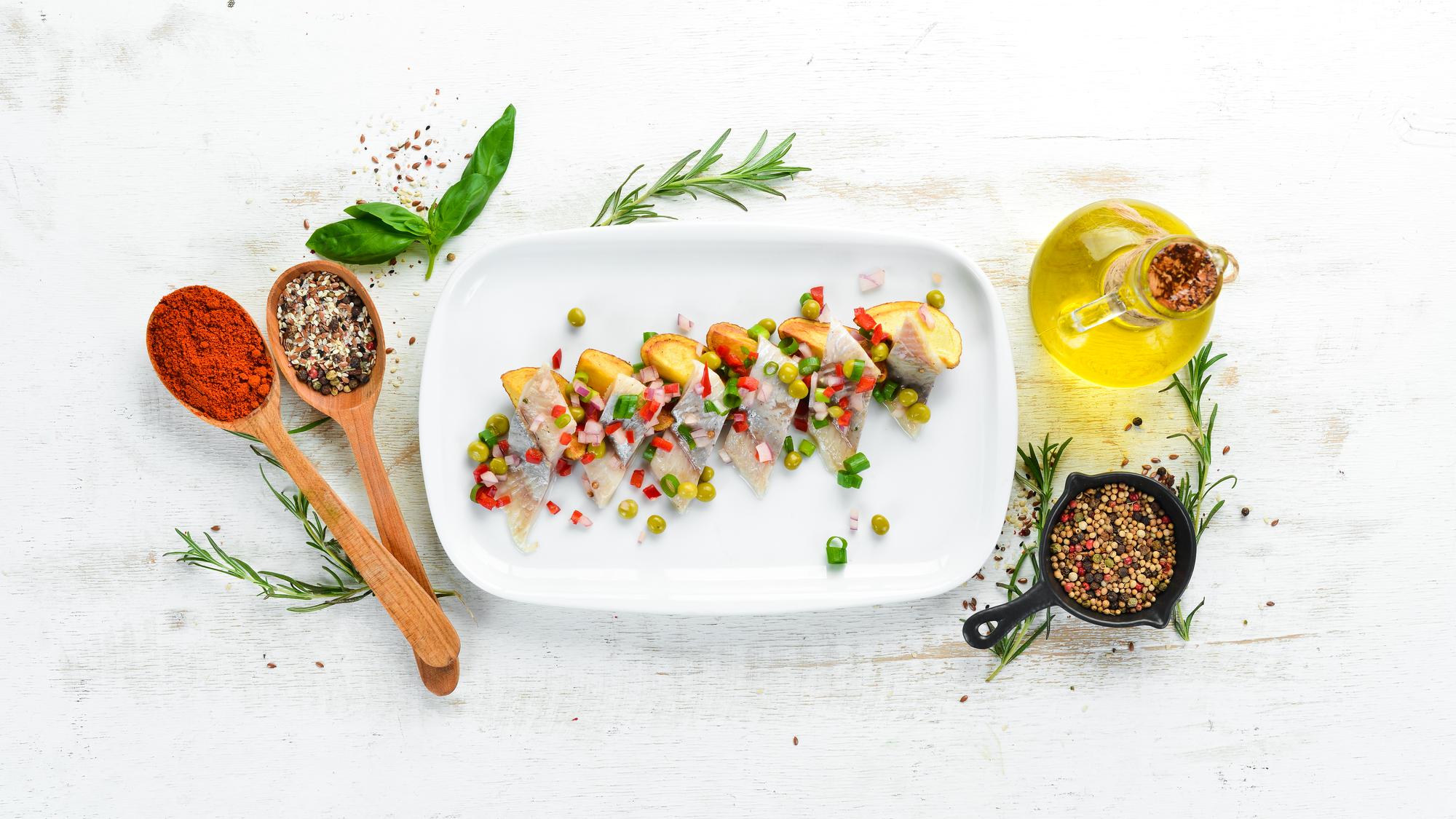 Plated starter with herbs and sauce